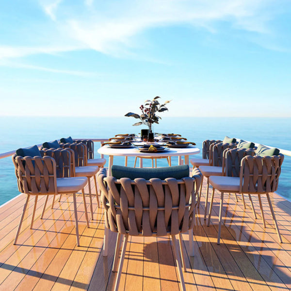 Juego de comedor moderno para exterior: mesa ovalada con sillones trenzados y cojines de felpa, aluminio, olefina/acrílico e impermeable.