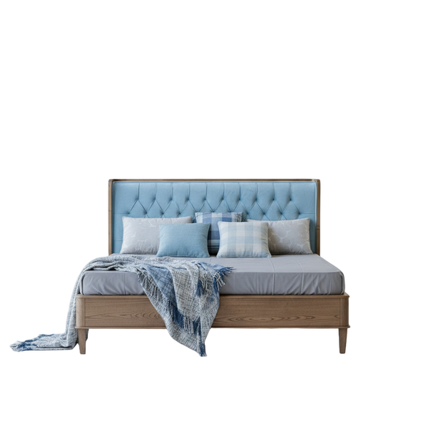 Bed with tufted headboard and pillows on a white background