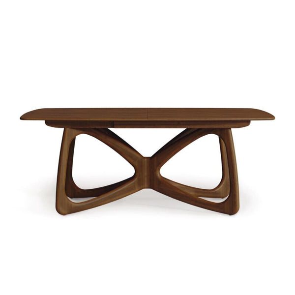 Mesa de comedor moderna de madera maciza: base geométrica y tablero redondeado.