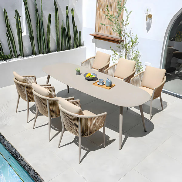 Juego de comedor contemporáneo para exterior: mesa ovalada con sillones y cojines de cuerda sintética, aluminio, olefina/acrílico e impermeable.