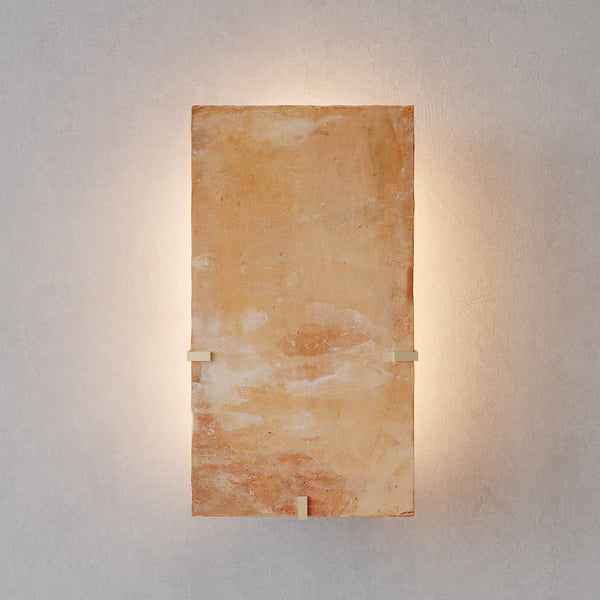 Backlit Blonde Terracotta Slab and Brass Wall Sconce