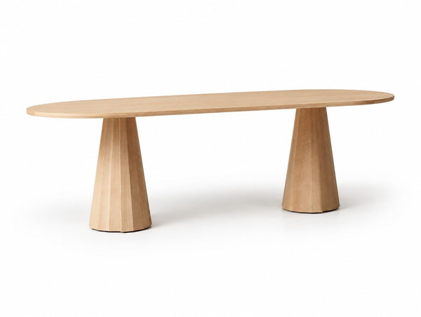 The Ferrassieres Dining Table on a white studio background