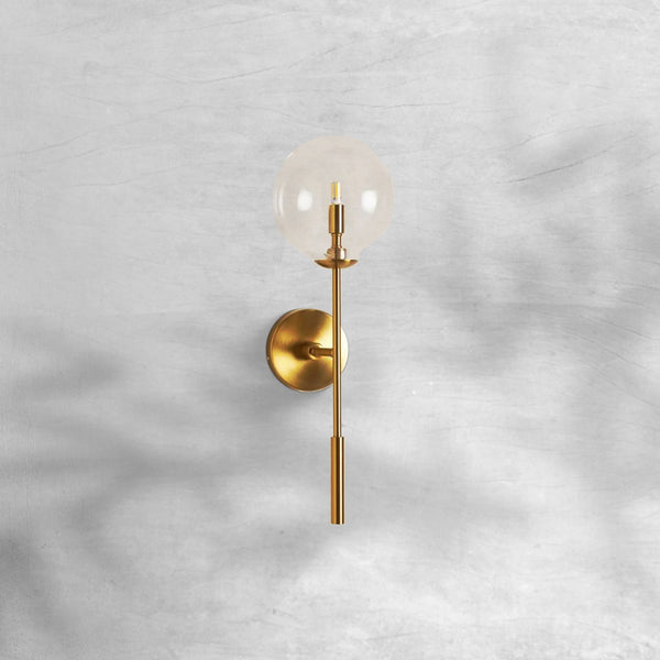 Clear Glass Globe Wall Sconce with Slender Brass Frame