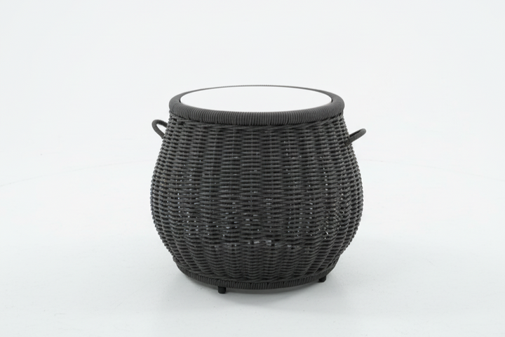 Black woven coffee table with a white interior on a light gray background