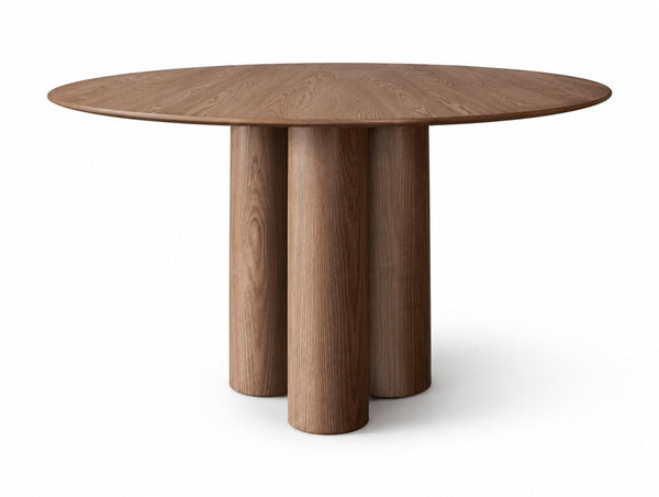 The Enna Dining Table on a white studio background