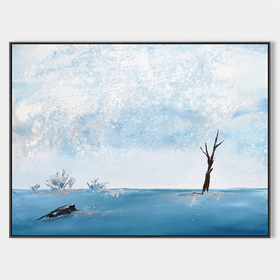Lone Tree on a Frozen Blue Shore