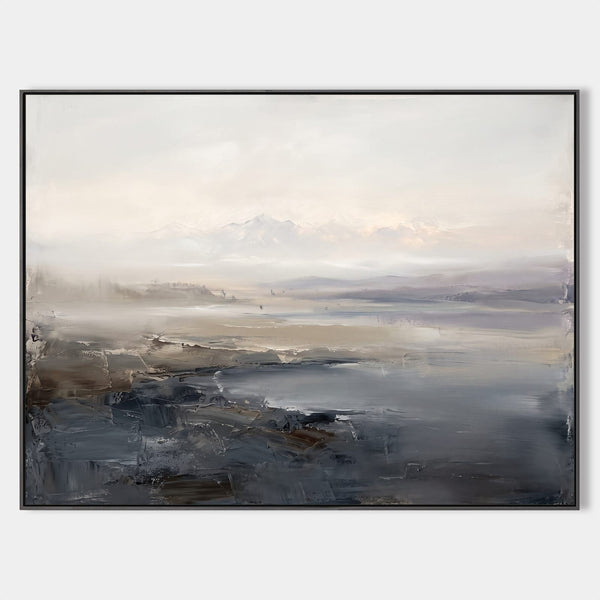 Misty Shoreline Beneath Pale Mountains