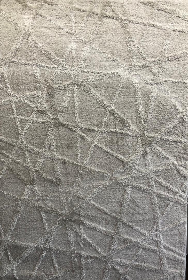 Modern gray geometric area rug with textured high-low abstract overlapping line pattern 1.5x2.2m