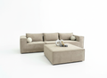 Cream modular sofa with curved sculptural lounge chair accent piece