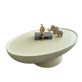 Modern minimalist pedestal coffee table side profile with low-profile round top and stone-look matte finish