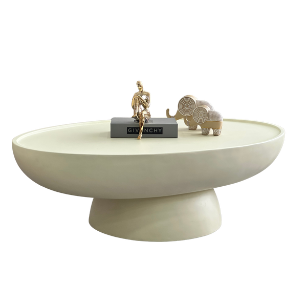Modern minimalist pedestal coffee table with wide stone-look matte top and sculptural base 120x65x28cm front view