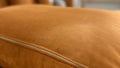 Mocha sectional sofa channel tufting detail side angle view
