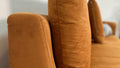 Modern mocha sectional sofa plush cushion and tufting close-up