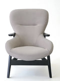 Taupe lounge chair winged high back side profile view
