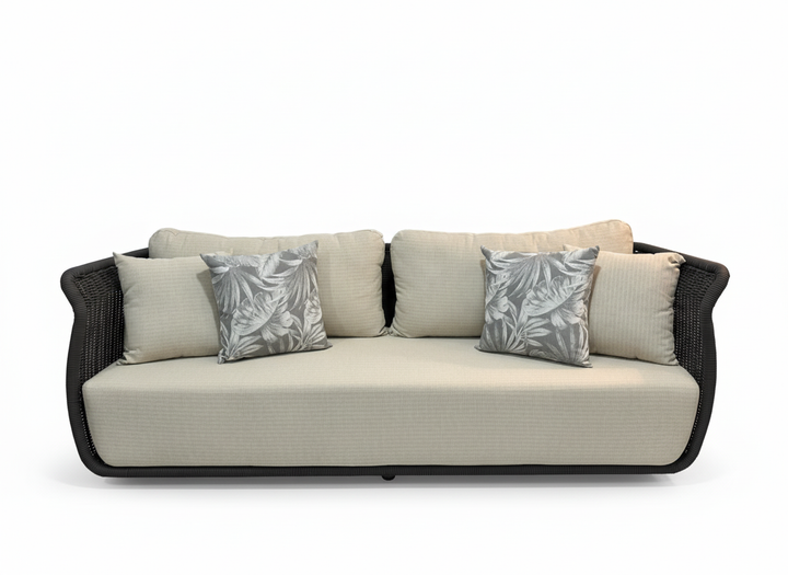 Beige outdoor sofa with black frame and patterned cushions on a white background