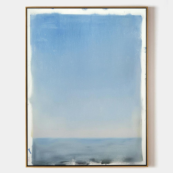 Soft Blue Horizon Over Still Water