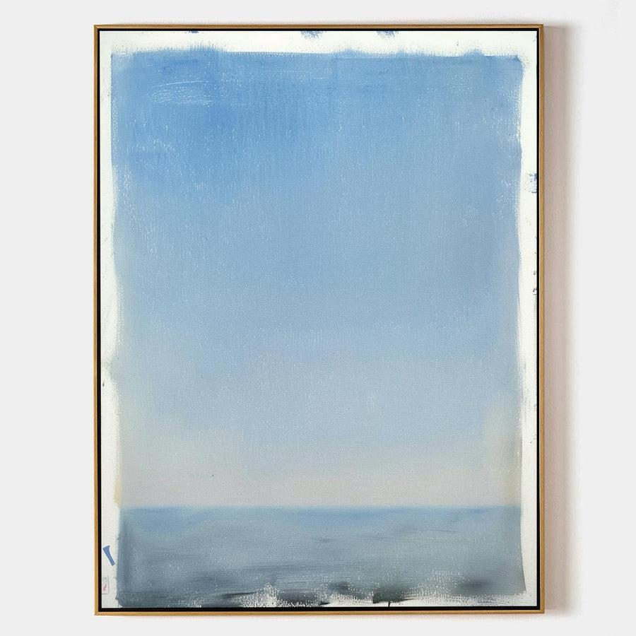 Soft Blue Horizon Over Still Water
