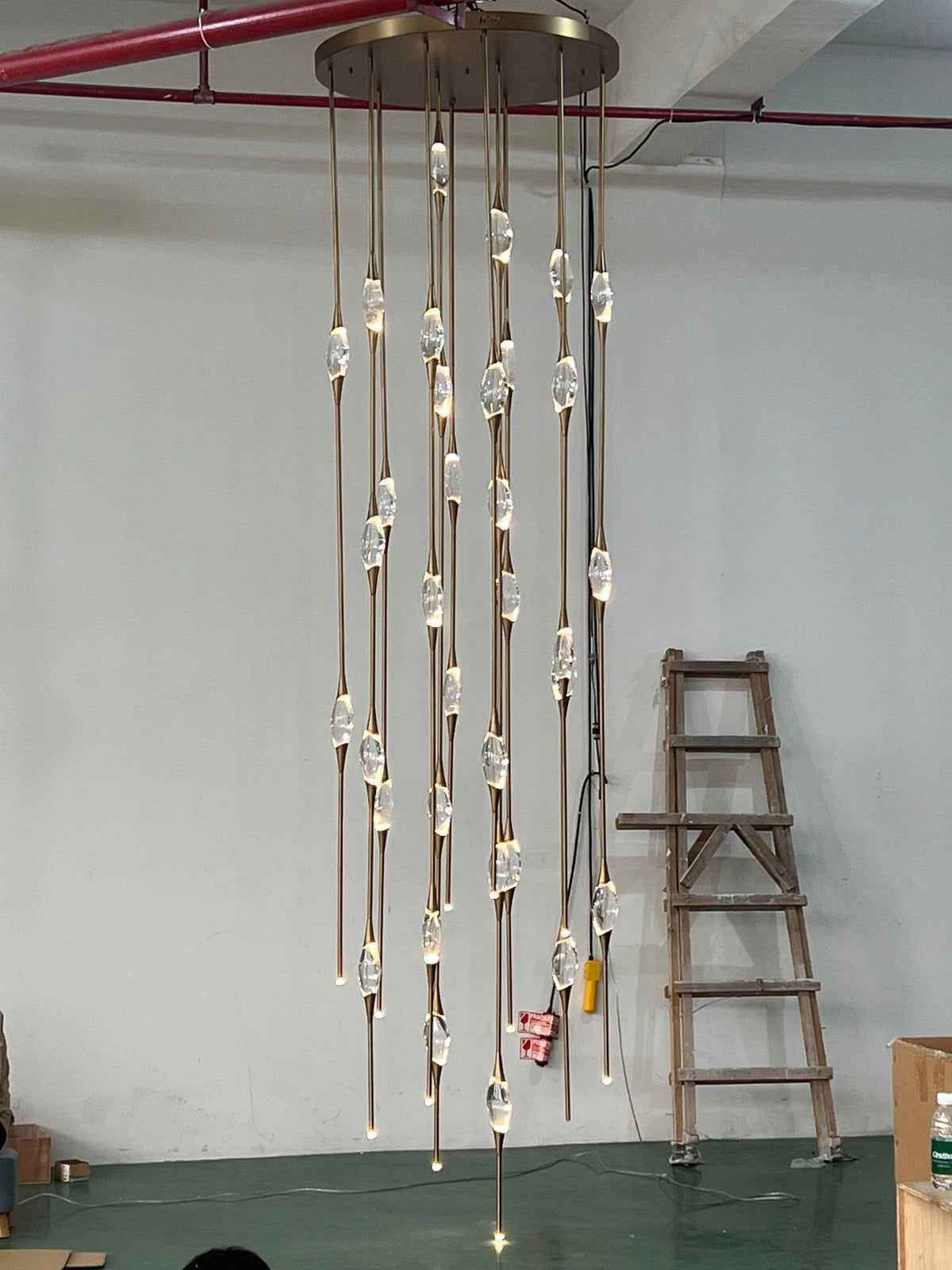 Tall Vertical Hand Blown Glass and Brass Chandelier