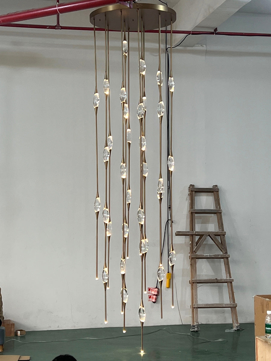 Tall Vertical Hand Blown Glass and Brass Chandelier